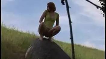 Girl pissing profusely stone