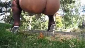 Woman with big ass poops in the park