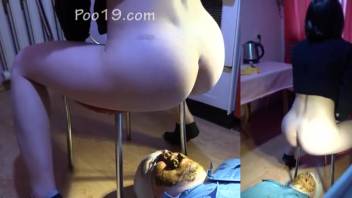 Guy serving as toilet for Russian chicks