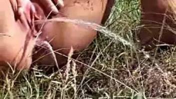 Young girl pissing hole