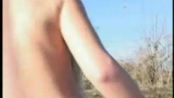 Pigtailed blonde poops outside