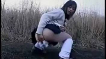 Japanese girl farts and pooping in the open field