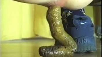 Close-up pooping girl ass