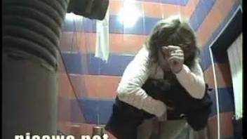 A woman in a white blouse in shit in toilet