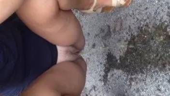 Woman pissing outdoor