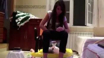 Twenties girl uses guy as a toilet